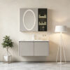 The bathroom vanity features a ceramic integrated basin for washing hands and face, and a solid wood, cream-colored finish.