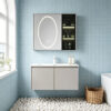 The bathroom vanity features a ceramic integrated basin for washing hands and face, and a solid wood, cream-colored finish.